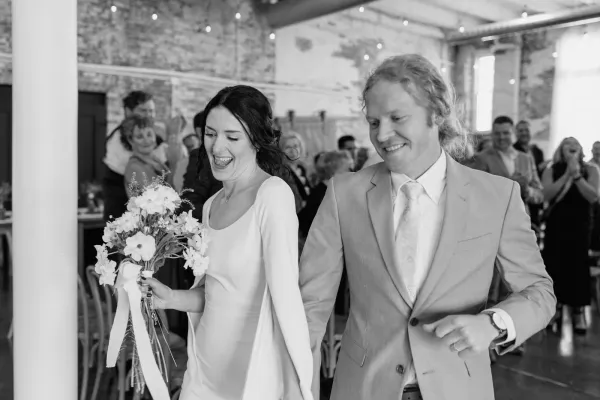 Guests cheer as the newlyweds make a grand entrance into their reception at 24 Shelby in downtown Indianapolis.
