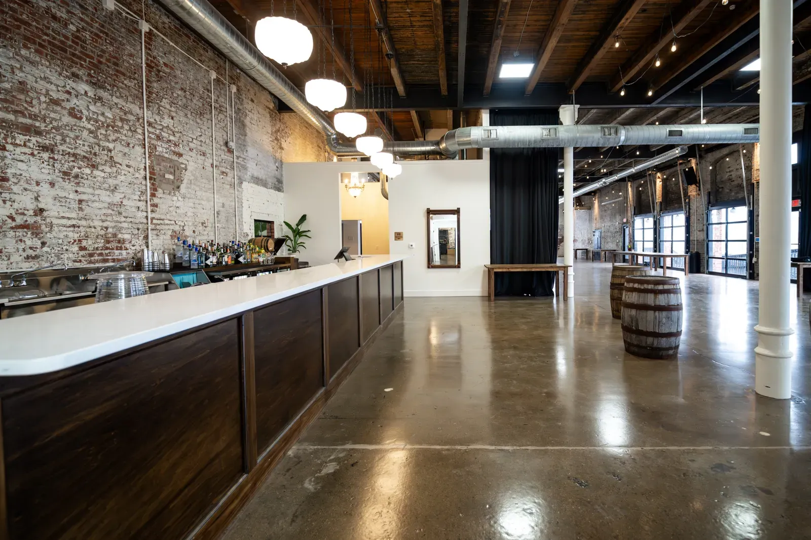 The Libations Lounge bar at 24 Shelby, the required in-house bar service at an Indianapolis wedding venue that allows outside catering with no catering minimum.