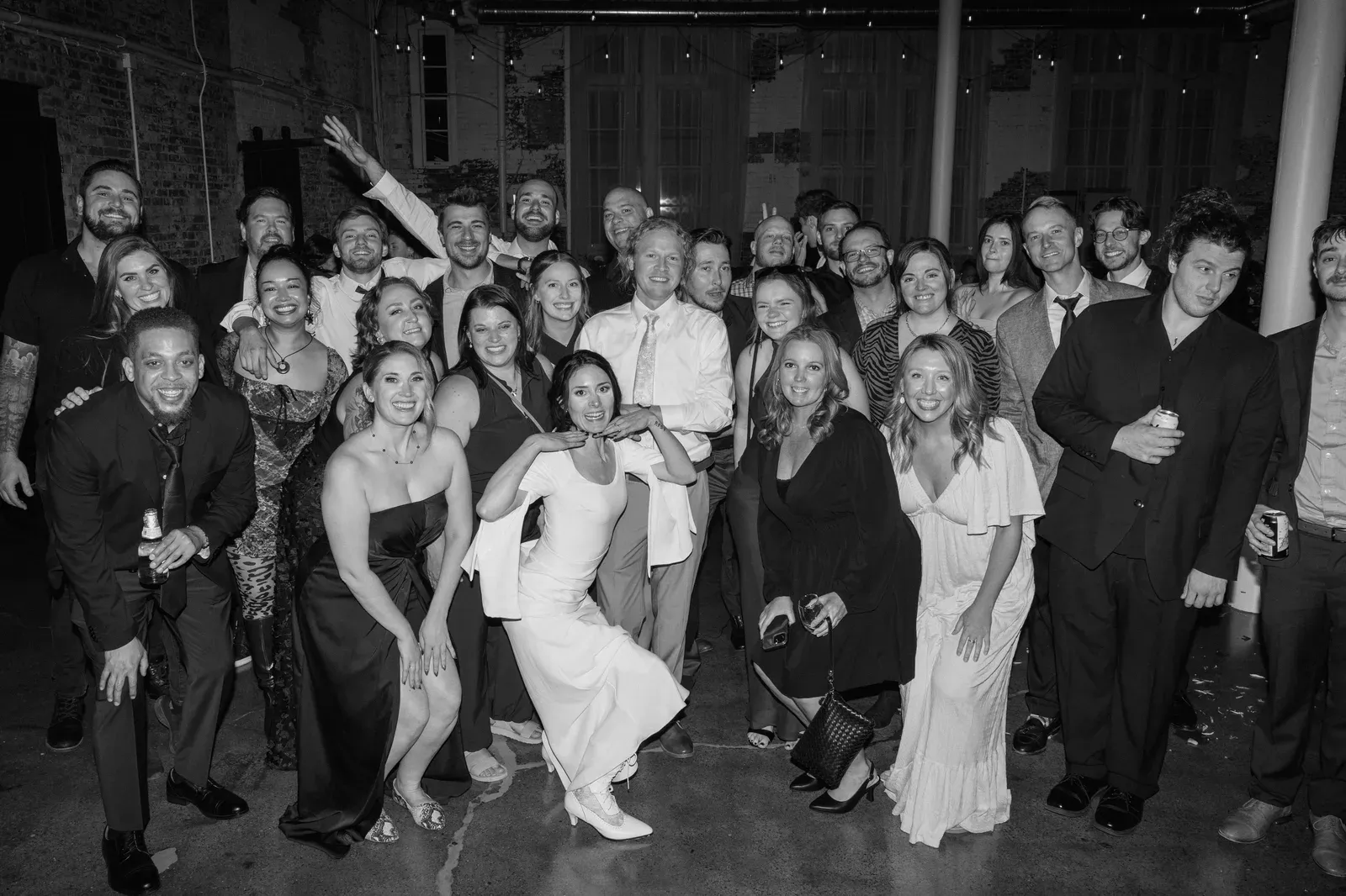 Wedding send-off at 24 Shelby in downtown Indianapolis with guests cheering as the couple exits at the end of the reception