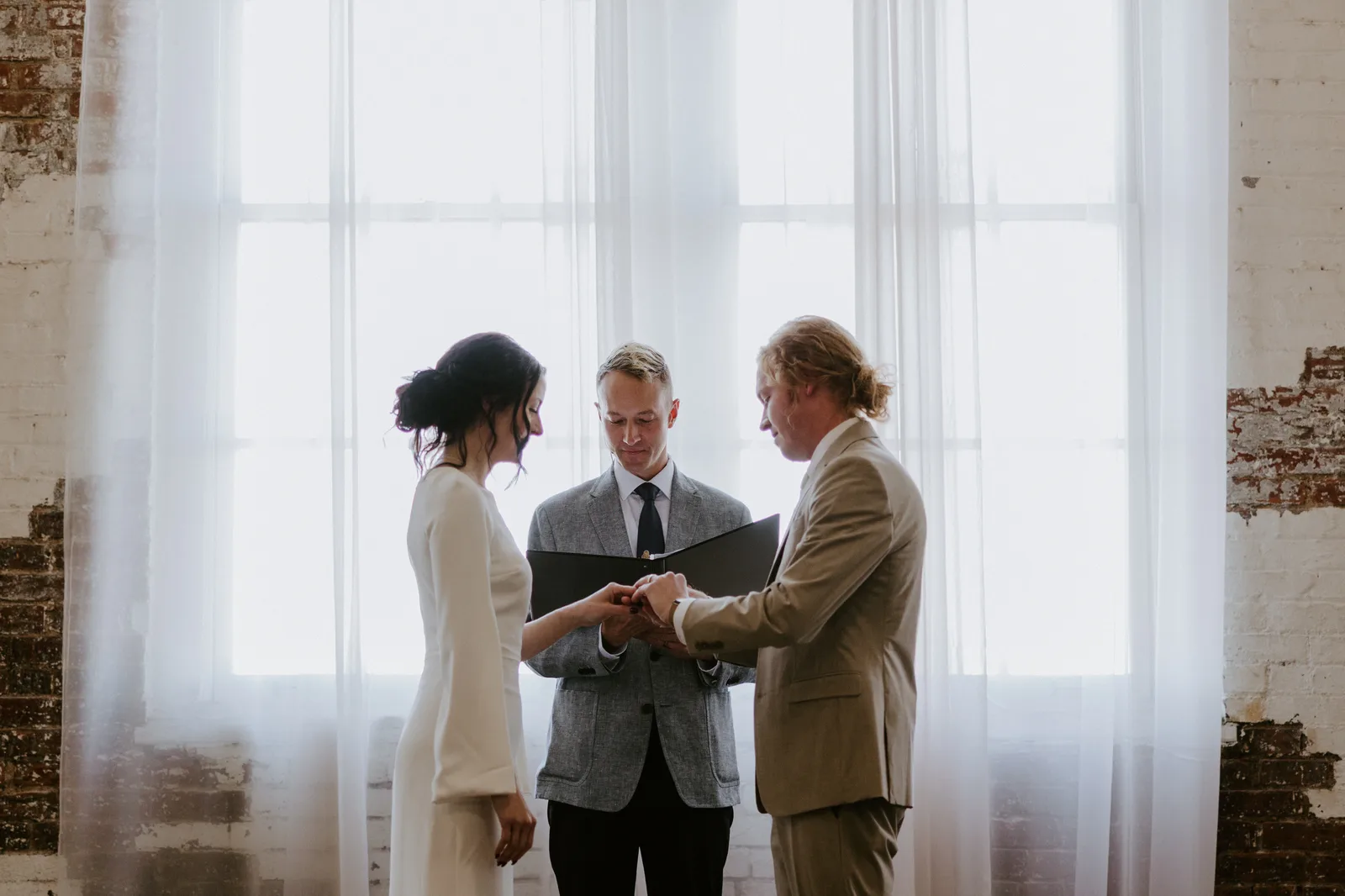 Marin and Chandler exchanging vows at 24 Shelby